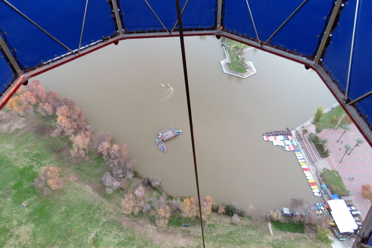 The lake and the string holding the balloon