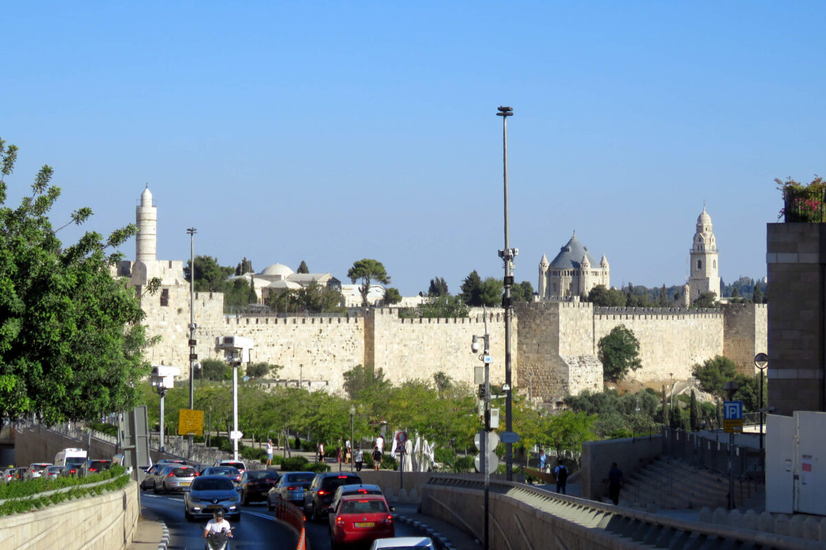 Two slender towers and one with a blue top